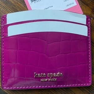 Kate Spade card holder.New with tag.Pink with animal print texture.